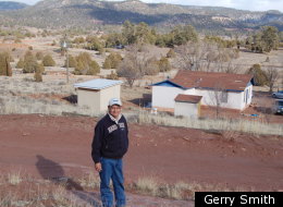 Sonny Clark, 59, must drive five miles up a mountain to get cellphone service connection and 40 miles to get online.