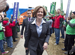 Conservative leader Alison Redford walks past Wildrose leader Danielle Smith supporters as she makes her way into the Alberta Election debate in Edmonton, Alta., on Thursday April 12, 2012. THE CANADIAN PRESS/Jason Franson.