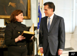 Mitt Romney speaks to Jane Swift as Massachusetts governor-elect.