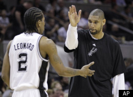 San Antonio Spurs' Tim Duncan, right, celebrates with teammate Kawhi Leonard (2) during the fourth quarter of an NBA basketball game against the Portland Trail Blazers, Monday, April 23, 2012, in San Antonio. San Antonio won 124-89, clinching the No. 1 seed in the Western Conference. (AP Photo/Eric Gay)