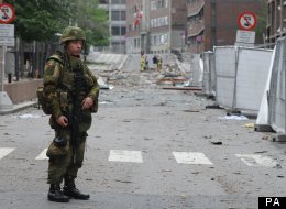 A soldier stands guard at the site of the attack in Oslo, Norway, 23 July 2011.