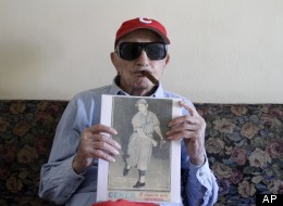 Cuban former pitcher Conrado Marrero, who once played with the Washington Senators, shows a photography of him on an old newspaper as he speaks during an interview in Havana, Cuba, Wednesday, April 25, 2012. Marrero, who last year became the oldest living former big leaguer, turned 101 on Wednesday. (AP Photo/Franklin Reyes)