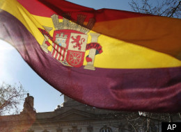 Standard & Poor's lowered Spain's long-term credit rating by two notches on Thursday, saying the country's budget problems are likely to get worse because of the weak economy.