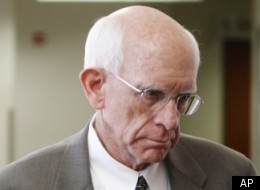Former Arapahoe County Sheriff Patrick Sullivan, left, and attorney Jessica Schmidt arrive at Arapahoe County district court where Sullivan waved his rights to a preliminary hearing in Centennial, Colo., on Monday, March 5, 2012. Sullivan faces charges of trading methamphetamine for sex. (AP Photo/Ed Andrieski)