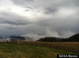 Mid-morning peak in light rainfall appears as clouds and fog at Purchase Knob in the Great Smoky Mountains National Park.