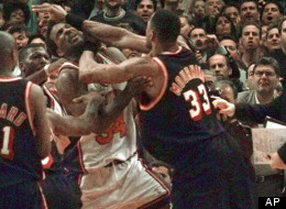 Knicks-Heat Rivalry: Miami Heat's Alonzo Mourning, right, and New York Knicks' Charles Oakley grapple as Knicks coach Jeff Van Gundy holds on, April 30, 1998.