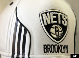 A hat bearing the new logo of the Brooklyn Nets is displayed during a news conference to unveil the new logos of the Brooklyn Nets in New York, Monday, April 30, 2012. The Nets will be moving from New Jersey to the new Barclays Center in Brooklyn, New York for the 2012-2013 NBA basketball season. (AP Photo/Seth Wenig)