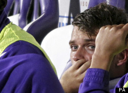 A smarting Adem Ljajic watches on from the bench after Delio Rossi attacked him