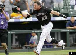 Colorado Rockies pinch hitter Jason Giambi (23) heads for home after hitting a walk-off home run off Los Angeles Dodgers relief pitcher Scott Elbert during the ninth inning of a baseball game, Wednesday, May 2, 2012, in Denver. The Rockies won 8-5. (AP Photo/Barry Gutierrez)