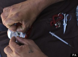An addict prepares a