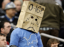 A fan wears a paper bag on his head during the Detroit Lions-New Orleans Saints NFL football game in Detroit, Sunday, Dec. 21, 2008.