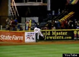 Corpus Christi outfielder, Austin Wates, makes an incredible over-the-wall catch while colliding with teammate Brandon Barnes.