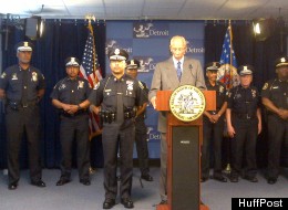 Detroit Police Chief Ralph Godbee, left, with Mayor Dave Bing at a press conference announcing a new incentive program for reserve police officers on May 10, 2012 in Detroit.
