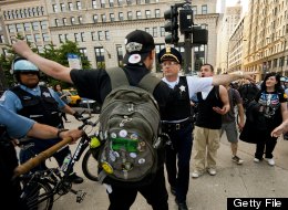 Demonstrators with Occupy Chicago argue with Chicago Police officers as they march through the streets in Chicago, Illinois, May 18, 2012 ahead of the NATO 2012 Summit. (JIM WATSON/AFP/GettyImages)