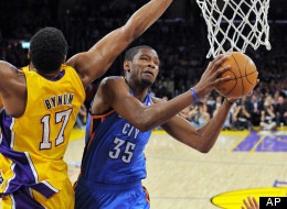 Oklahoma City Thunder forward Kevin Durant, right, goes up for a shot as Los Angeles Lakers center Andrew Bynum defends during the first half in Game 4 of an NBA basketball playoffs Western Conference semifinal, Saturday, May 19, 2012, in Los Angeles. (AP Photo/Mark J. Terrill)