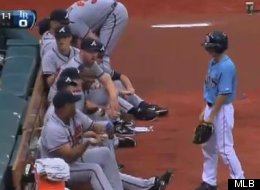 Braves reliever Livan Hernandez welcomes a Tampa Bay Rays ballboy to the majors with a shower of sunflower seeds after witnessing him miss a ground ball.