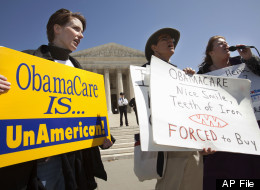 Amy Brighton of Medina, Ohio, left, protest against the health care law with other members of the Tea Party Patriots, Monday, March 26, 2012. (AP Photo/Jacquelyn Martin)