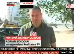 Is that a real sandstorm, or is this Romanian TV reporter just throwing dust in our eyes? (YouTube)