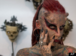 Maria Jose Cristerna poses for pictures during a press conference at a tattoo shop in Bogota, Colombia, Friday, June 3, 2011. (AP Photo/William Fernando Martinez)
