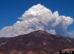 In this May 22, 2012 file photo provided by David Thornburg, a plume of smoke rises from the Whitewater fire burning in the Gila Wilderness east of Glenwood, N.M. (AP Photo/David Thornburg, File)