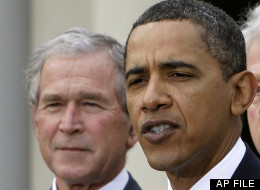 In this Jan. 16, 2010 file photo, former President George W. Bush listens to President Barack Obama in the Rose Garden at the White House in Washington. Bush is returning to the White House on May 31 for the unveiling of his official portrait. (AP Photo/Alex Brandon)