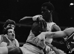Orlando Woolridge (center) battles for a rebound during NBA action, February 24, 1982 in Chicago.