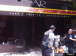 Police investigate the remains of Velvet Rope Ultra Lounge, a popular gay bar in Oak Park, Ill.