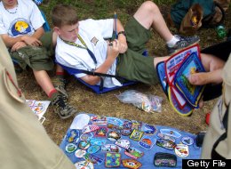 Boy scouts trade patches July 31, 2001 during the 15th National Scout Jamboree at Fort A.P. Hill, Va. (Photo by Alex Wong/Getty Images)