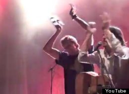 Dirk Nowitzki holds up a tambourine during his performance with the Avett Brothers.