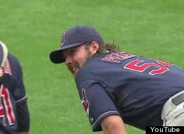Indians' pitcher Chris Perez laughs with catcher Carlos Santana after vomiting during a 4-1 win over the Cardinals.