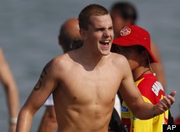 Canada's Richard Weinberger reacts after winning the gold medal for the men's 10km open water swimming race at the Pan American Games in Puerto Vallarta, Mexico, Saturday Oct. 22, 2011. (AP Photo/Eduardo Verdugo)