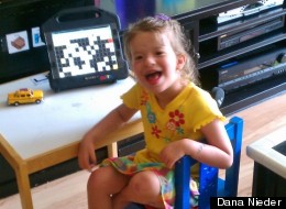 Maya sits by her iPad with the app Speak for Yourself launched. It was pulled from the Apple Store last week.