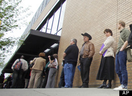In this April 24, 2012, photo shows job seekers waiting in line during a job fair, In Portland, Ore.