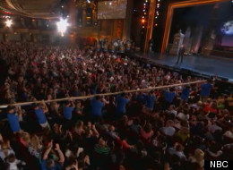 The Vienna Beef-created hot dog is hoisted into the Chicago Theatre Wednesday.