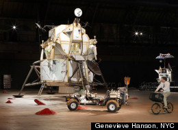 Installation view of the Landing Excursion Module (LEM), Mars Excursion Roving Vehicle (MERV), and Tom Sachs on WAR Bike in