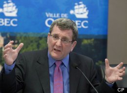 Quebec City Mayor Regis Labeaume was caught up in a shoving match over a new city bylaw on Tuesday that ended with one man being arrested for assault. THE CANADIAN PRESS/Jacques Boissinot