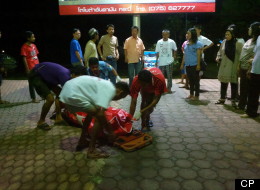 A medical team from Phi Phi Island Hospital place a body on a stretcher at the Phi Phi Palm Residence Hotel on Phi Phi Island on Friday, June 15, 2012. A tiny Quebec town near the border with Maine is still reeling after two of its residents were found dead halfway around the world. Police in Phuket, Thailand say it doesn't appear sisters Noemi and Audrey Belanger were murdered. They believe the two young women may have been accidentally poisoned while vacationing in the southeast Asian country.
