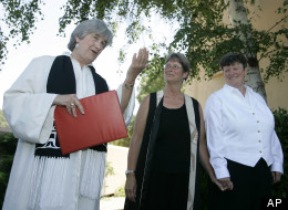 In this June 20, 2008 file photo, the Rev. Jane Spahr, left, a Presbyterian minister, performs a same-sex marriage for Sherrie Holmes, center, and Sara Taylor, at the Marin Civic Center in San Rafael, Calif. The church's highest court later found Spahr guilty of misconduct for officiating the marriage.