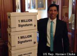 Congressman Clarke stands with over 1 million signatures in support of the Student Loan Forgiveness Act of 2012, which he introduced to the House in March. (U.S. Rep Hansen Clarke)