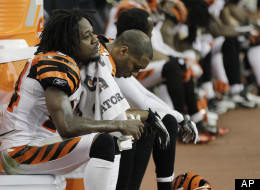 Cincinnati Bengals' Adam Jones (24) and Chris Crocker sit on the bench during the fourth quarter against the Houston Texans in an NFL wild card playoff football game Saturday, Jan. 7, 2012, in Houston.