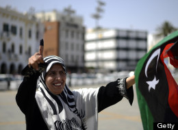 A Libyan woman celebrates in Martyrs' Square in Tripoli after voting for the Libyan General National Assembly on July 7, 2012. ( AFP PHOTO/GIANLUIGI GUERCIA)