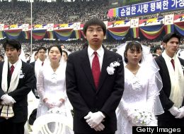 Some 60,000 Unification Church members took part in a mass wedding ceremony at the Chamsil Olympic Stadium in Seoul on Feb. 13, 2000.
