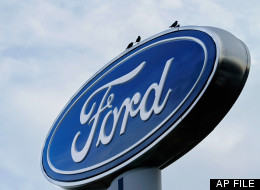 In this July 24, 2011 file photo, the Ford logo is displayed at an auto dealership in Springfield, Ill. (AP Photo/Seth Perlman, File)