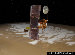 NASA's Mars Odyssey spacecraft passes above Mars' south pole in this artist's concept illustration. The spacecraft has been orbiting Mars since October 24, 2001.