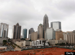 CHARLOTTE, NC - JULY 11: The Bank of America Corporate Center building, which houses the corporate headquarters for Bank of America, rises above the Charlotte skyline on July 11, 2012 in Charlotte, North Carolina.