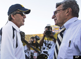 In this Sept. 22, 2007 file photo, Michigan coach Lloyd Carr, left, shakes hands with Penn State coach Joe Paterno, right, after the Wolverines won 14-9 in an NCAA college football game in Ann Arbor, Mich. (AP Photo/Tony Ding, File)