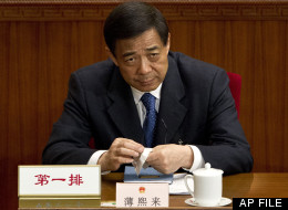 In this file photo taken on March 11, 2012, Chongqing party secretary Bo Xilai attends a plenary session of the National People's Congress at the Great Hall of the People in Beijing. (AP Photo/Andy Wong, File)