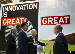 Republican presidential candidate and former Massachusetts Gov. Mitt Romney, second left, tours the GREAT Pavillion Exhibit with British Foreign Secretary William Hague in London, Thursday, July 26, 2012.