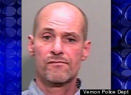David Caruso is accused of driving through a security checkpoint with a beer in his hand.