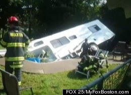 Officials had to use a crane and a dump truck to remove this 28-foot RV camper from the swimming pool the driver crashed into.